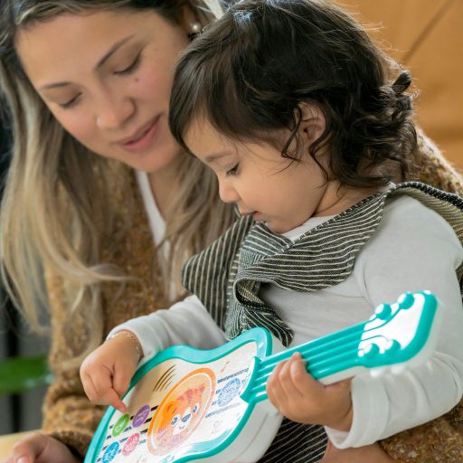 BABY EINSTEIN Zenélő fa játék ukulele Magic Touch HAPE 6hó+