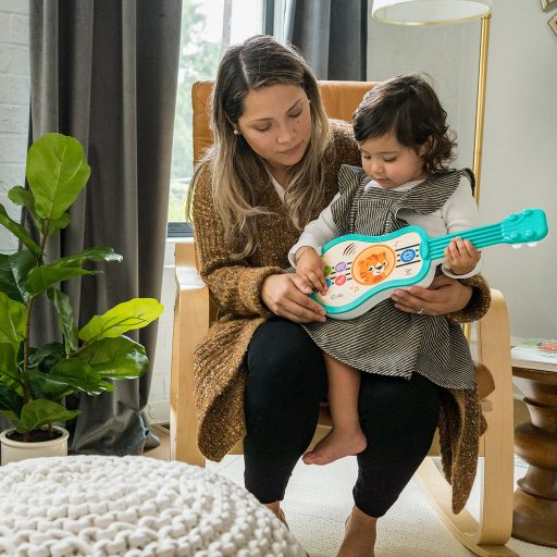 BABY EINSTEIN Zenélő fa játék ukulele Magic Touch HAPE 6hó+