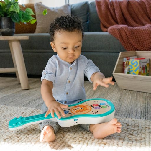 BABY EINSTEIN Zenélő fa játék ukulele Magic Touch HAPE 6hó+