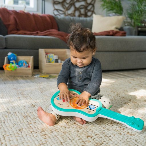 BABY EINSTEIN Zenélő fa játék ukulele Magic Touch HAPE 6hó+